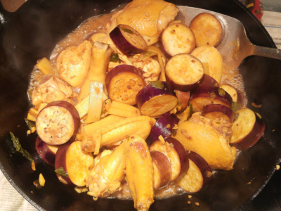 Lastly, add the eggplant slices and stir to coat with the golden sauce. Cover and simmer.