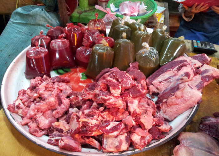 Fresh meat, blood and bile for sale at the market in LP